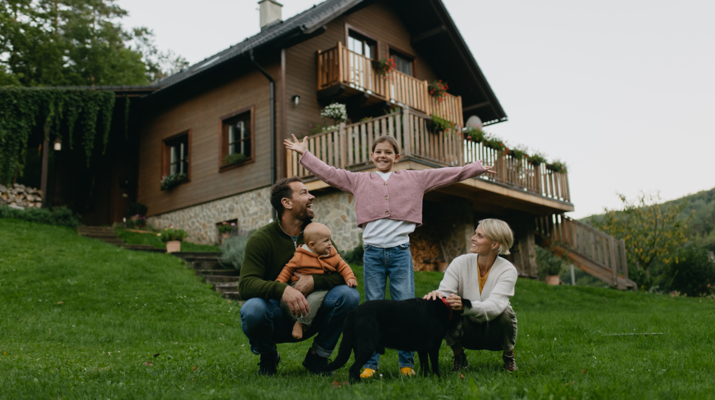 Family in front of house